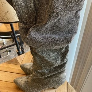 Silver sparkly knee high boots.
